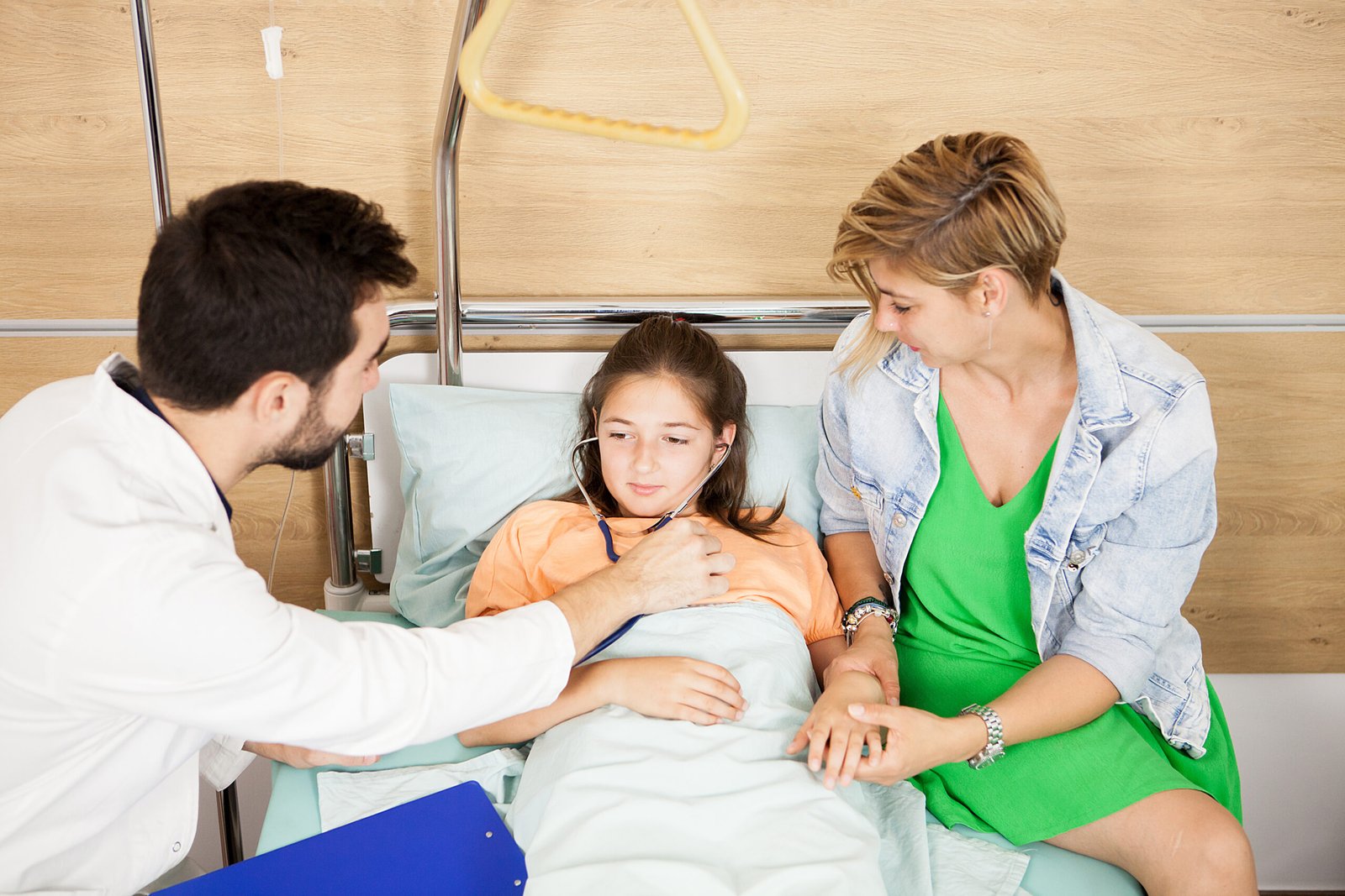 Doctor checking her patient heart in hospital